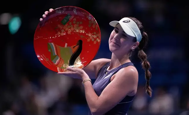 Switzerland's Belinda Bencic celebrates after winning against Czech Republic's Linda Noskova in the final match of the Pan Pacific Open women's tennis tournament at Ariake Coliseum, in Tokyo, Sunday, Oct. 26, 2025. (AP Photo/Louise Delmotte)
