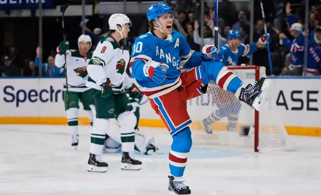New York Rangers' Artemi Panarin (10) celebrates after scoring a goal during the first period of an NHL hockey game against the Minnesota Wild Monday, Oct. 20, 2025, at Madison Square Garden in New York. (AP Photo/Frank Franklin II)