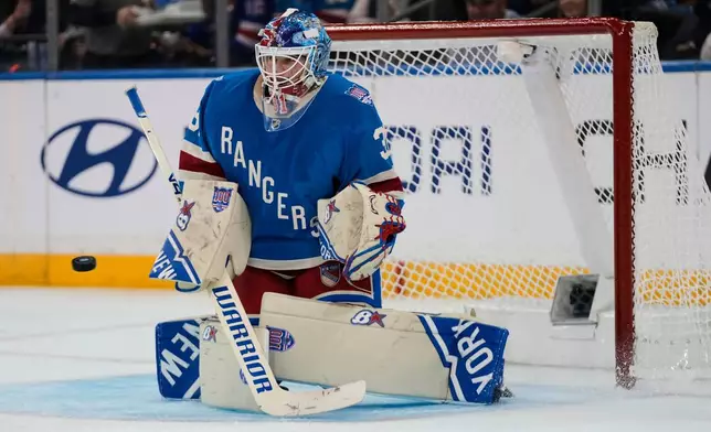 New York Rangers goaltender Igor Shesterkin (31) stops a shot during the second period of an NHL hockey game against the Minnesota Wild Monday, Oct. 20, 2025, at Madison Square Garden in New York. (AP Photo/Frank Franklin II)