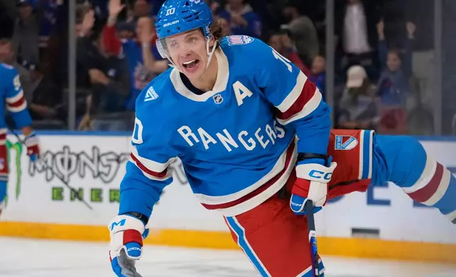 New York Rangers' Artemi Panarin (10) celebrates after scoring a goal during the first period of an NHL hockey game against the Minnesota Wild Monday, Oct. 20, 2025, at Madison Square Garden in New York. (AP Photo/Frank Franklin II)
