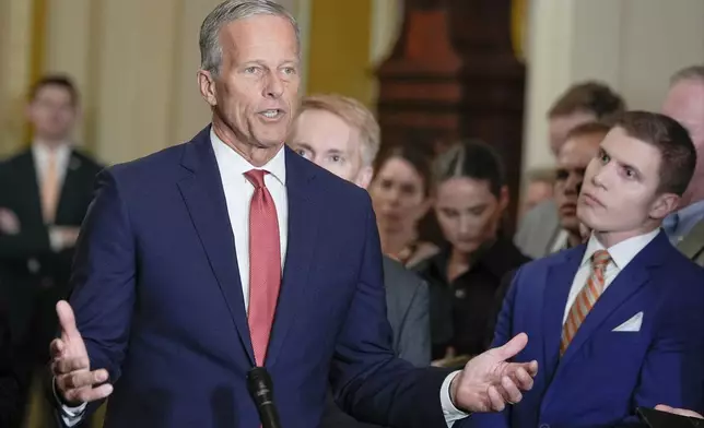 Senate Majority Leader John Thune, R-S.D., left, speaks during a news conference after a policy luncheon at the Capitol, Tuesday, Sept. 30, 2025, in Washington. (AP Photo/Mariam Zuhaib)