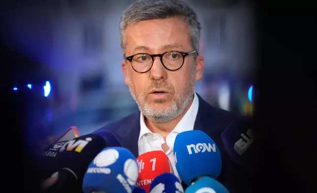 Lisbon Mayor Carlos Moedas speaks to journalists at the site of a derailed electric streetcar in downtown Lisbon, Wednesday, Sept. 3, 2025. (AP Photo/Armando Franca)