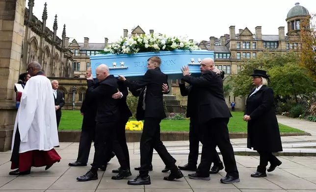 The coffin of Ricky Hatton is carried into Manchester Cathedral, in Manchester, England, Friday, Oct. 10, 2025. (Danny Lawson/PA via AP)