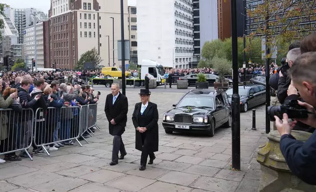 The funeral cortege for boxer Ricky Hatton arrives at Manchester cathedral for the service in Manchester, England, Friday, Oct. 10, 2025. (AP Photo/Jon Super)