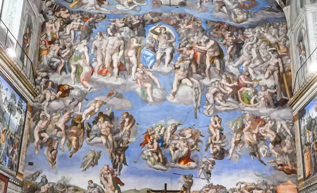 In this picture made available by Vatican media, Britain's King Charles III, second from right, and Queen Camilla, right, attend a joint prayer with Pope Leo XIV, fourth from right, and the Archbishop of York Stephen Cottrell, fifth from right, in the Sistine Chapel at the Vatican on the theme of 'Care for Creation', Thursday, Oct. 23, 2025. (Vatican Media via AP, HO)