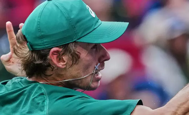 Alex De Minaur of Australia returns a forehand shot from Nuno Borges of Portugal during the men's singles match of the Shanghai Masters tennis tournament at Qizhong Forest Sports City Tennis Center, in Shanghai, China, Wednesday, Oct. 8, 2025. (AP Photo/Andy Wong)