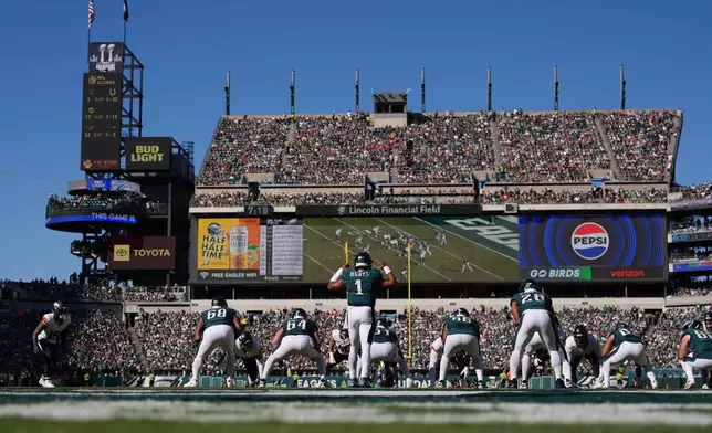 Philadelphia Eagles quarterback Jalen Hurts (1) signals during the second half of an NFL football game against the Denver Broncos on Sunday, Oct. 5, 2025, in Philadelphia. (AP Photo/Matt Slocum)
