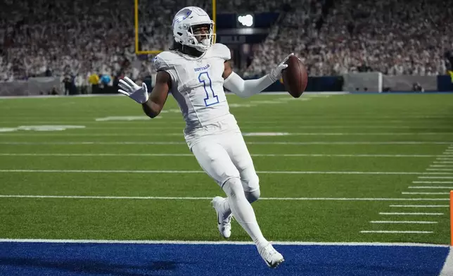 Buffalo Bills wide receiver Curtis Samuel (1) scores a touchdown on a catch and run against the New England Patriots during the second half of an NFL football game, Sunday, Sept. 5, 2025, in Orchard Park, N.Y. (AP Photo/Gene J. Puskar)