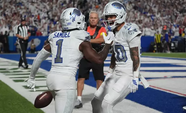 Buffalo Bills wide receiver Curtis Samuel (1) celebrates his touchdown catch with teammates Khalil Shakir (10) during the second half of an NFL football game against the New England Patriots, Sunday, Sept. 5, 2025, in Orchard Park, N.Y. (AP Photo/Gene J. Puskar)