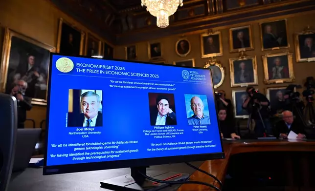 Joel Mokyr, from left, Philippe Aghion and Peter Howitt (on screen) announced as the recipients of the Nobel Memorial Prize in Economics during a press conference at the Royal Swedish Academy of Sciences in Stockholm, Sweden, Monday, Oct. 13, 2025. (Anders Wiklund/TT News Agency via AP)