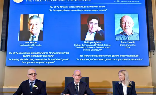 Professor John Hassler, from left, Hans Ellegren, Permanent Secretary of the Academy of Sciences and Professor Kerstin Enflo, announce Joel Mokyr, Philippe Aghion and Peter Howitt as the recipients the Nobel Memorial Prize in Economics during a press conference at the Royal Swedish Academy of Sciences in Stockholm, Sweden, Monday, Oct. 13, 2025. (Anders Wiklund/TT News Agency via AP)