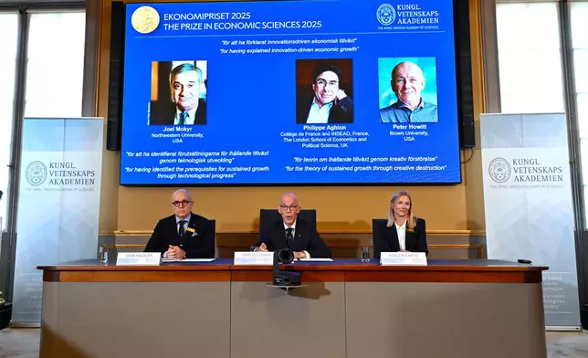 Professor John Hassler, from left, Hans Ellegren, Permanent Secretary of the Academy of Sciences and Professor Kerstin Enflo, announce Joel Mokyr, Philippe Aghion and Peter Howitt as the recipients of the Nobel Memorial Prize in Economics during a press conference at the Royal Swedish Academy of Sciences in Stockholm, Sweden, Monday, Oct. 13, 2025. (Anders Wiklund/TT News Agency via AP)