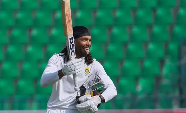 South Africa's Tony dy Zorzi celebrates after scoring century during the third day of the first test cricket match between Pakistan and South Africa, in Lahore, Pakistan, Tuesday, Oct. 14, 2025. (AP Photo/K.M. Chaudary)