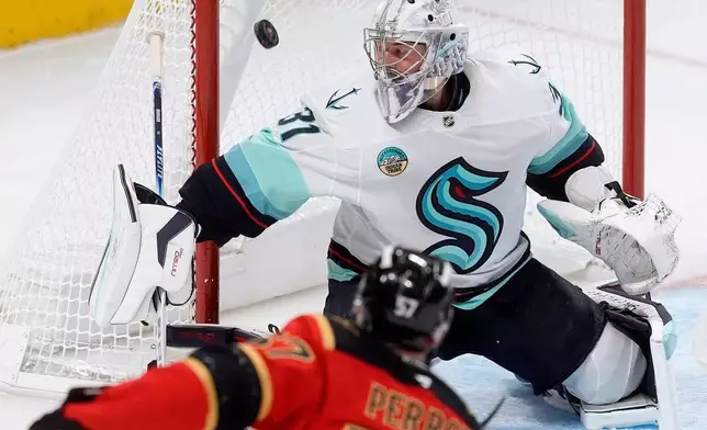 Ottawa Senators left wing David Perron (57) fires the puck past Seattle Kraken goaltender Philipp Grubauer (31) during first period NHL action in Ottawa, Thursday, Oct. 16, 2025. (Adrian Wyld/The Canadian Press via AP)