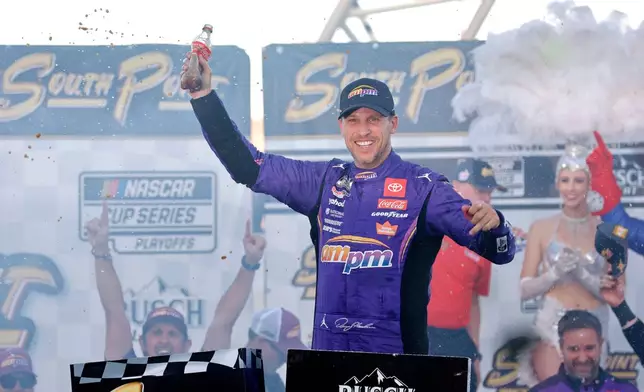 Denny Hamlin celebrates in victory lane after winning a NASCAR Cup Series auto race Sunday, Oct. 12, 2025, in Las Vegas. (AP Photo/Steve Marcus)