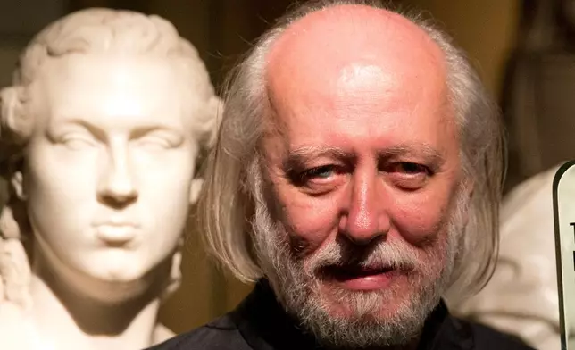 FILE - Hungary's Laszlo Krasznahorkai poses for photographers in London, Tuesday, May 19, 2015. (AP Photo/Matt Dunham, File)