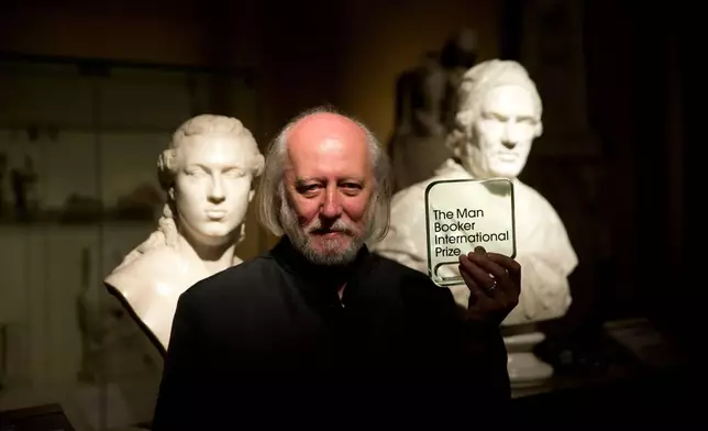 FILE - Hungary's Laszlo Krasznahorkai poses for photographers in London, Tuesday, May 19, 2015. (AP Photo/Matt Dunham, File)