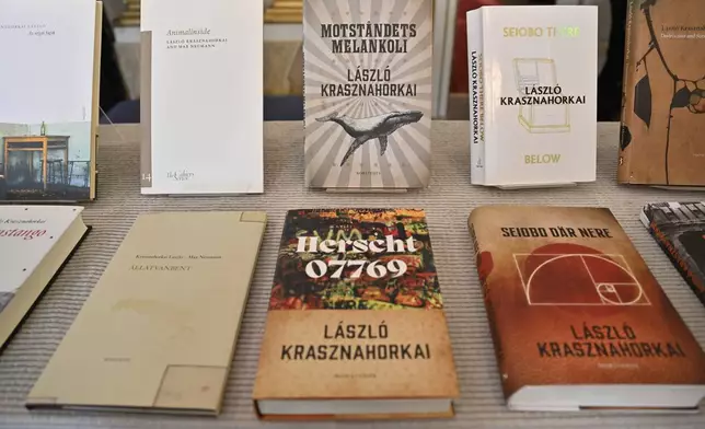 Books by Hungarian author László Krasznahorkai at Börshuset in Stockholm, after he was announced as the recipient of the Nobel Prize in Literature at the Nobel Assembly of the Karolinska Institutet, in Stockholm, Sweden, Thursday, Oct. 9, 2025. (Henrik Montgomery/TT News Agency via AP)
