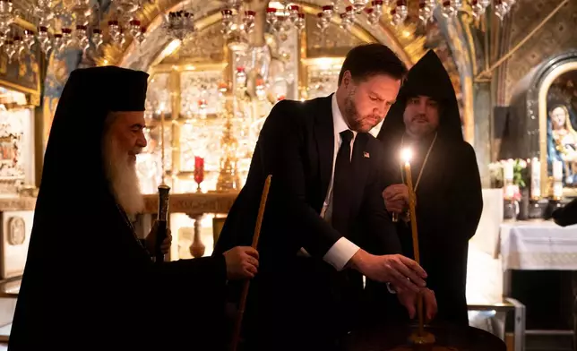 U.S. Vice President JD Vance, center, tours The Church of the Holy Sepulchre in the Old City of Jerusalem Thursday, Oct. 23, 2025. (Nathan Howard/Pool Photo via AP)