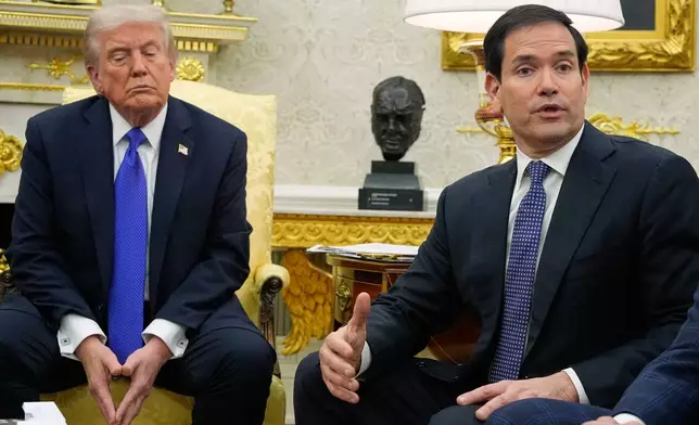President Donald Trump listens as Secretary of State Marco Rubio speaks during a meeting with NATO Secretary General Mark Rutte in the Oval Office of the White House, Wednesday, Oct. 22, 2025, in Washington. (AP Photo/Alex Brandon)