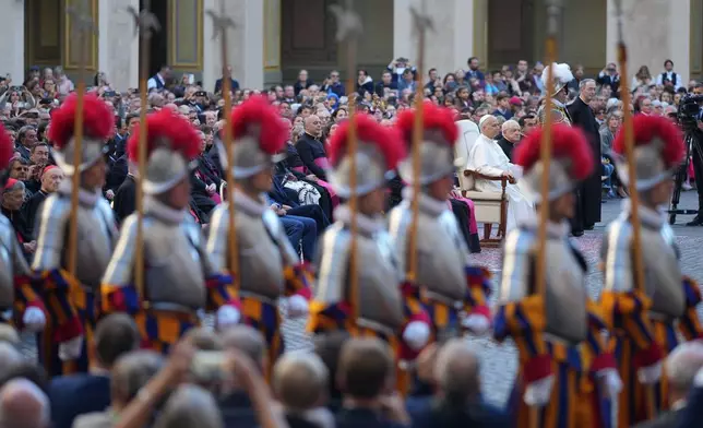 Pope Leo XIV attends the swearing in ceremony of 27 Pontifical Swiss Guards cadets in the St. Damasus courtyard at the Vatican, Saturday, Oct. 4, 2025. (AP Photo/Andrew Medichini)