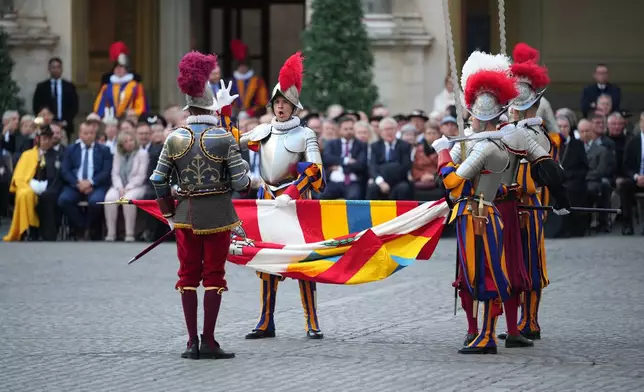 One of 27 cadets of the Pontifical Swiss Guard pronounces the swearing-in oath in the St. Damasus Courtyard at the Vatican, Saturday, Oct. 4, 2025. (AP Photo/Andrew Medichini)