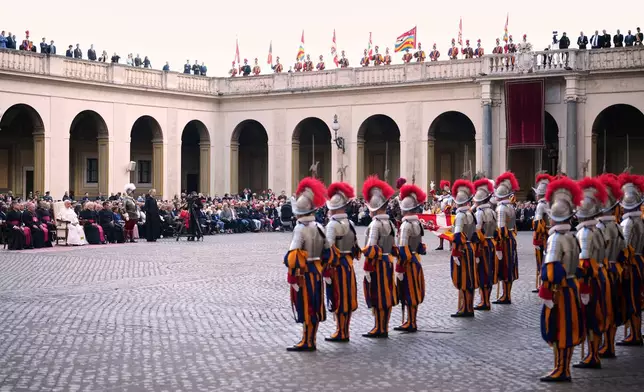 Pope Leo XIV attends the swearing in ceremony of 27 Pontifical Swiss Guards cadets in the St. Damasus Courtyard at the Vatican, Saturday, Oct. 4, 2025. (AP Photo/Andrew Medichini)