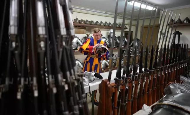 Pontifical Swiss Guards prepare ahead of their swearing in ceremony, at the Vatican, Saturday, Oct. 4, 2025. (AP Photo/Andrew Medichini)