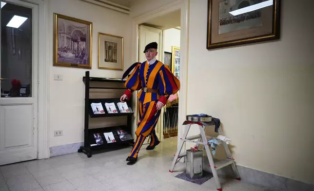 Pontifical Swiss Guards prepare ahead of their swearing in ceremony, at the Vatican, Saturday, Oct. 4, 2025. (AP Photo/Andrew Medichini)