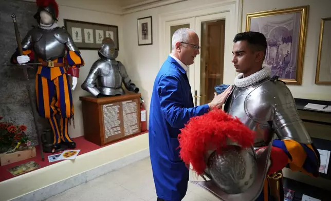 Pontifical Swiss Guards prepare ahead of their swearing in ceremony, at the Vatican, Saturday, Oct. 4, 2025. (AP Photo/Andrew Medichini)