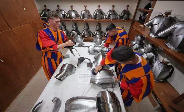 Pontifical Swiss Guards prepare ahead of their swearing in ceremony, at the Vatican, Saturday, Oct. 4, 2025. (AP Photo/Andrew Medichini)