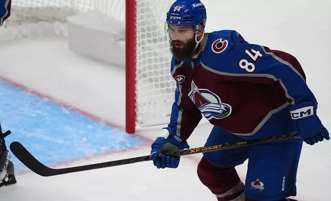 Colorado Avalanche defenseman Brent Burns pursues the puck in the third period of an NHL hockey game against the Utah Mammoth, Thursday, Oct. 9, 2025, in Denver. (AP Photo/David Zalubowski)