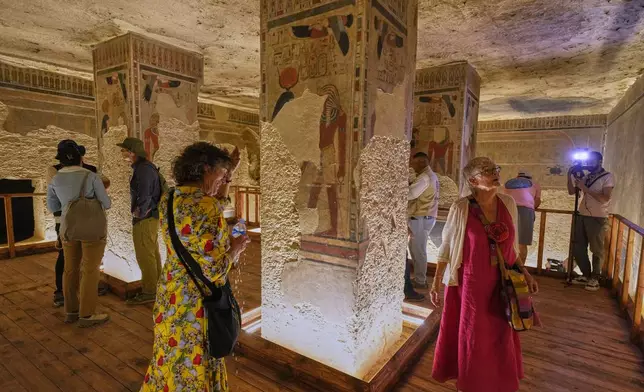 Visitors view the tomb of Amenhotep III, who ruled ancient Egypt between 1390 B.C. and 1350 B.C., in the Valley of Kings in the southern city of Luxor, Egypt, Saturday, Oct. 4, 2025, as it opened to visitors for the first time in more than two decades. (AP Photo/Amr Nabil)