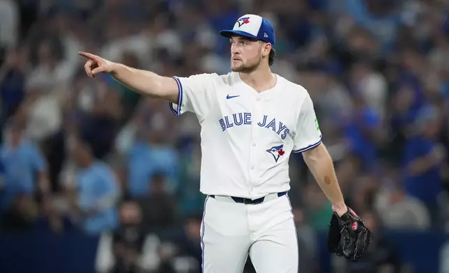Toronto Blue Jays pitcher Trey Yesavage reacts after a fifth inning-ending double play in Game 6 of baseball's American League Championship Series against the Seattle Mariners in Toronto, Sunday, Oct. 19, 2025. (Nathan Denette/The Canadian Press via AP)