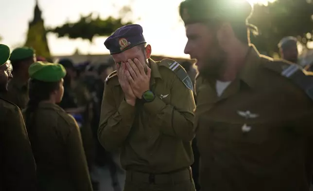 Israel soldiers mourn during the funeral of comrade Staff Sergeant Itay Yavetz, killed in Gaza, in Modiin, Israel, Monday, Oct. 20, 2025. (AP Photo/Francisco Seco)