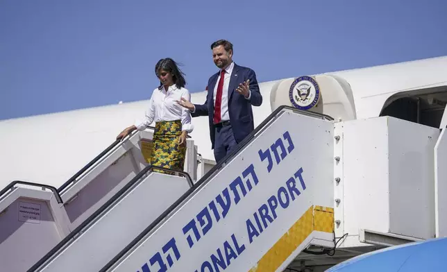 Vice President J.D. Vance, right, and Second Lady Usha Vance arrive at Ben Gurion airport in Tel Aviv, Israel, Tuesday, Oct. 21, 2025. (Nathan Howard/Pool Photo via AP)