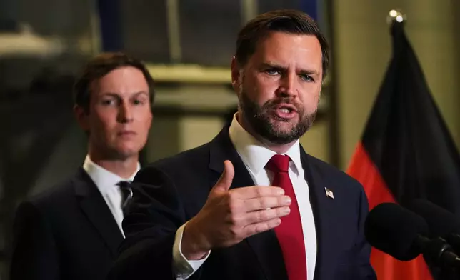 U.S. Vice President JD Vance speak to the media as Jared Kushner looks on, in Kiryat Gat, Israel, Tuesday, Oct. 21, 2025. (AP Photo/Francisco Seco)