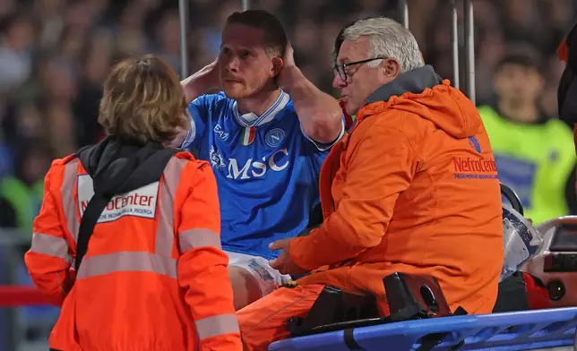 Napoli's Kevin De Bruyne is carried off the pitch after getting injured during the Italian Serie A soccer match between Napoli and Inter Milan, in Naples, Italy, Saturday, Oct. 25, 2025. (Alessandro Garofalo/LaPresse via AP)