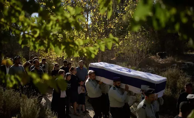 Members of Israeli defense forces carry the coffin of the reservist Master Sergeant Yona Efraim Feldbaum, who was killed in the Gaza Strip, during his funeral at Mount Herzl military cemetery, in Jersualem, Wednesday, Oct. 29, 2025. (AP Photo/Leo Correa)