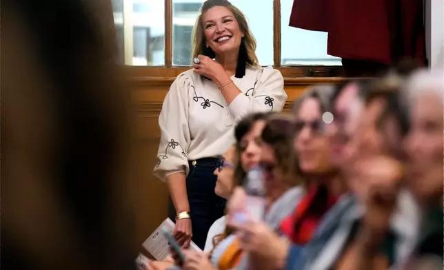 Best-selling Christian writer and influencer Jen Hatmaker waits to be introduced to talk about her new book, "Awake," in Nashville, Tenn., on Sept. 25, 2025. (AP Photo/Mark Humphrey)