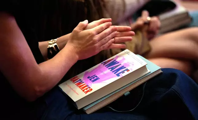 Audience members applaud author and influencer Jen Hatmaker as she talks about her new book, "Awake," in Nashville, Tenn., on Sept. 25, 2025. (AP Photo/Mark Humphrey)