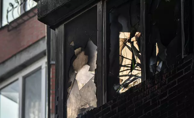 An apartment building damaged in Russian attacks, Wednesday, Oct. 22, 2025, in Kyiv, Ukraine. (AP Photo/Julia Demaree Nikhinson)