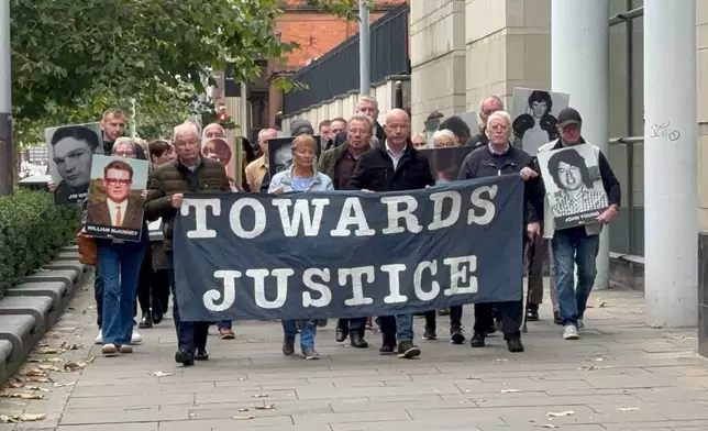 Families of James Wray and William McKinney who were shot dead during the events of Bloody Sunday arrive at Belfast Crown Court as the trial of a former paratrooper accused of their murders during the events of Bloody Sunday in Londonderry in 1972 on Thursday, Oct. 16, 2025. (Rebecca Black/PA via AP)