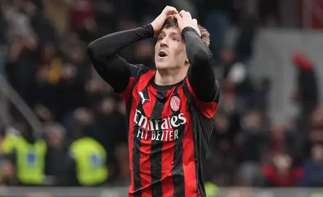AC Milan's Alexis Saelemaekers reacts after a miss during the Serie A soccer match between AC Milan and Pisa in Milan, Italy, Friday, Oct. 24, 2025. (AP Photo/Antonio Calanni)
