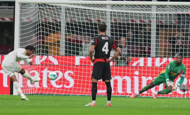 Pisa's Juan Cuadrado scores from a penalty kickduring the Serie A soccer match between AC Milan and Pisa in Milan, Italy, Friday, Oct. 24, 2025. (AP Photo/Antonio Calanni)