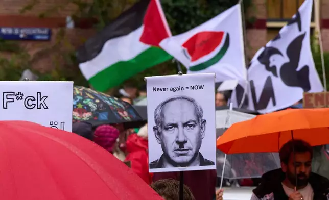 Thousands of protesters march demanding their government do more to halt Israel's campaign in Gaza, during a demonstration in Amsterdam, Netherlands, Sunday, Oct. 5, 2025. (AP Photo/Peter Dejong)