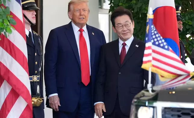 FILE - President Donald Trump, left, greets South Korean President Lee Jae Myung upon his arrival at the White House, on Aug. 25, 2025, in Washington. (AP Photo/Alex Brandon, File)