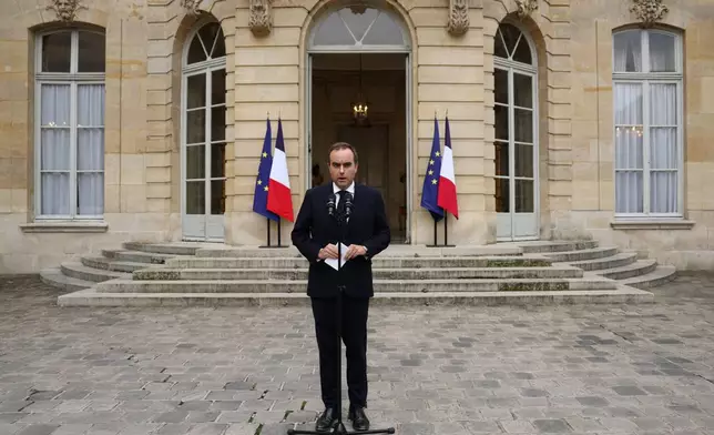 French outgoing Prime Minister Sebastien Lecornu, who resigned just a day after naming his government, delivers his statement at the Hotel Matignon in Paris, Monday, Oct. 6, 2025. (Stephane Mahe/Pool via AP)