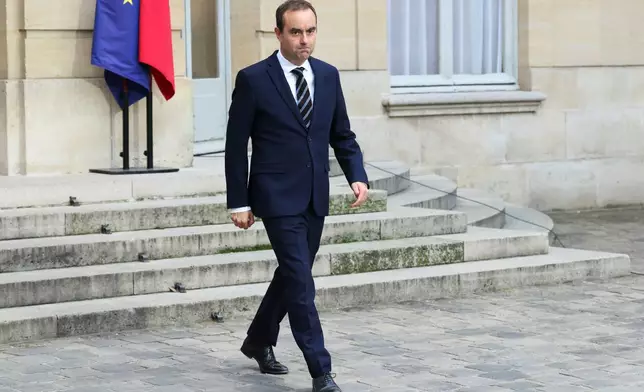 French Prime Minister Sebastien Lecornu arrives to deliver a statement at the Hotel Matignon in Paris, Friday Oct. 3, 2025, before a round of consultations with political parties ahead of the announcement of the new government. (Alain Jocard, Pool Photo via AP)