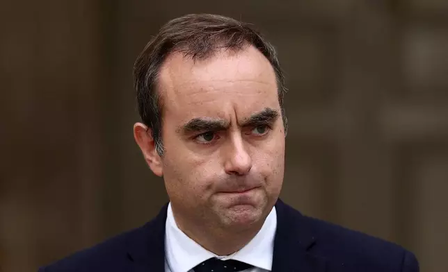 French outgoing Prime Minister Sebastien Lecornu, who resigned just a day after naming his government, arrives to deliver his statement at the Hotel Matignon in Paris, Monday, Oct. 6, 2025. (Stephane Mahe/Pool via AP)